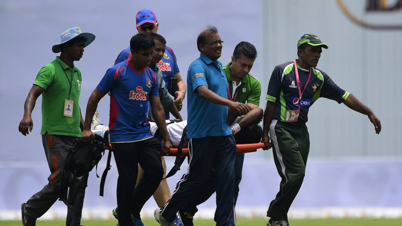 Shahadat Hossain is stretchered off the field