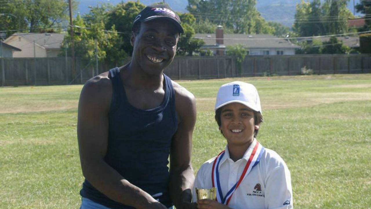Owen Graham presenting a trophy to NCCA Youth player