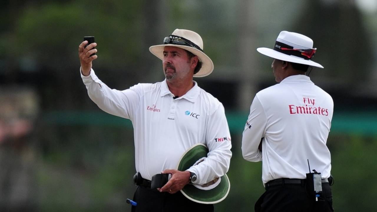 Umpire Richard Illingworth examines the light meter reading,  Sri Lanka v Pakistan, 2nd Test, Colombo, 3rd day, June 27, 2015