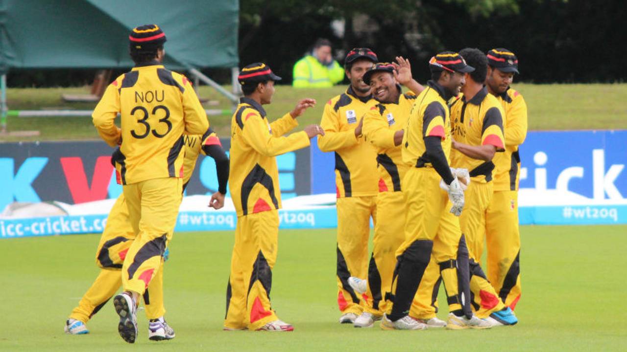 Mahuru Dai is mobbed by his team-mates, Nepal v Papua New Guinea, World T20 Qualifier, Group A, Dublin, July 17, 2015