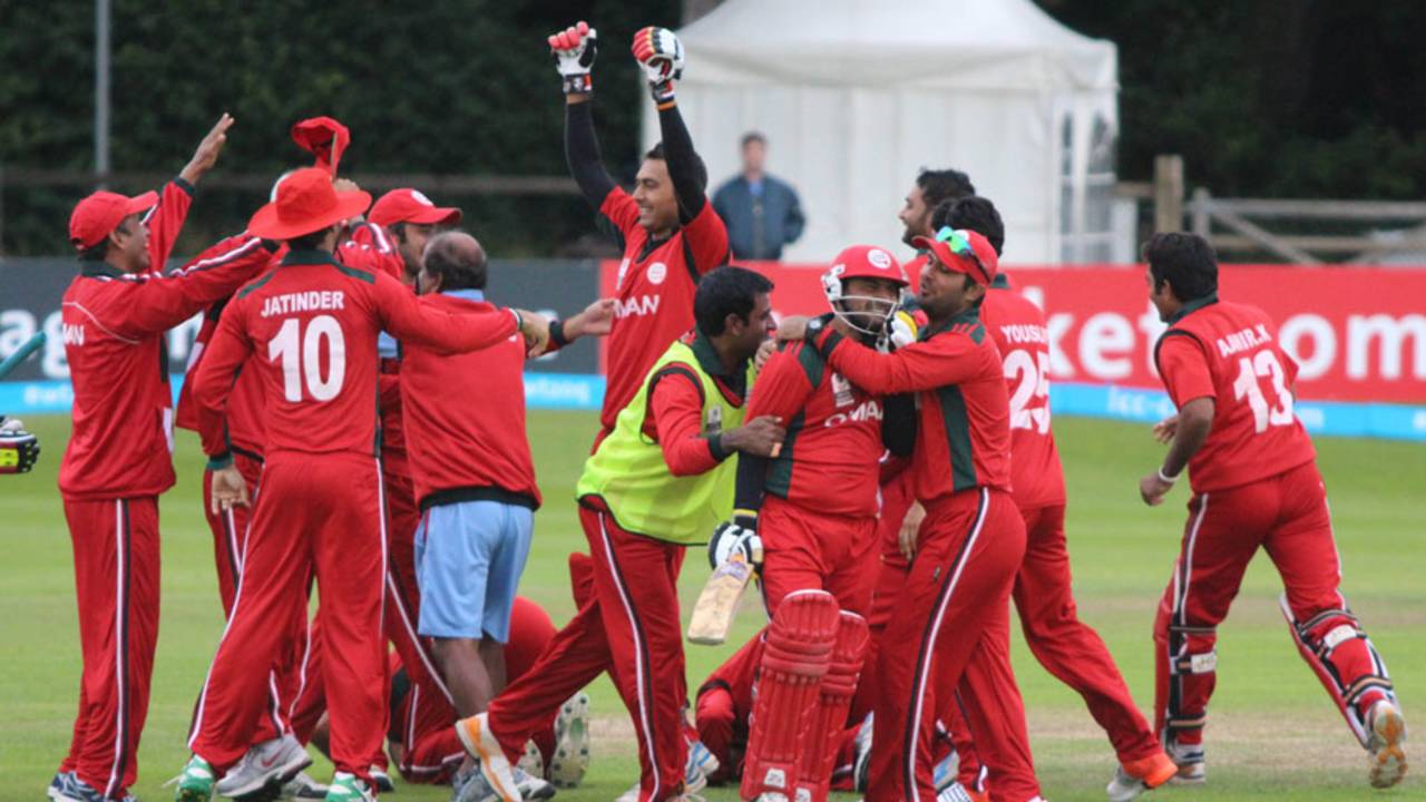 Zeeshan Siddiqui is mobbed by elated team-mates