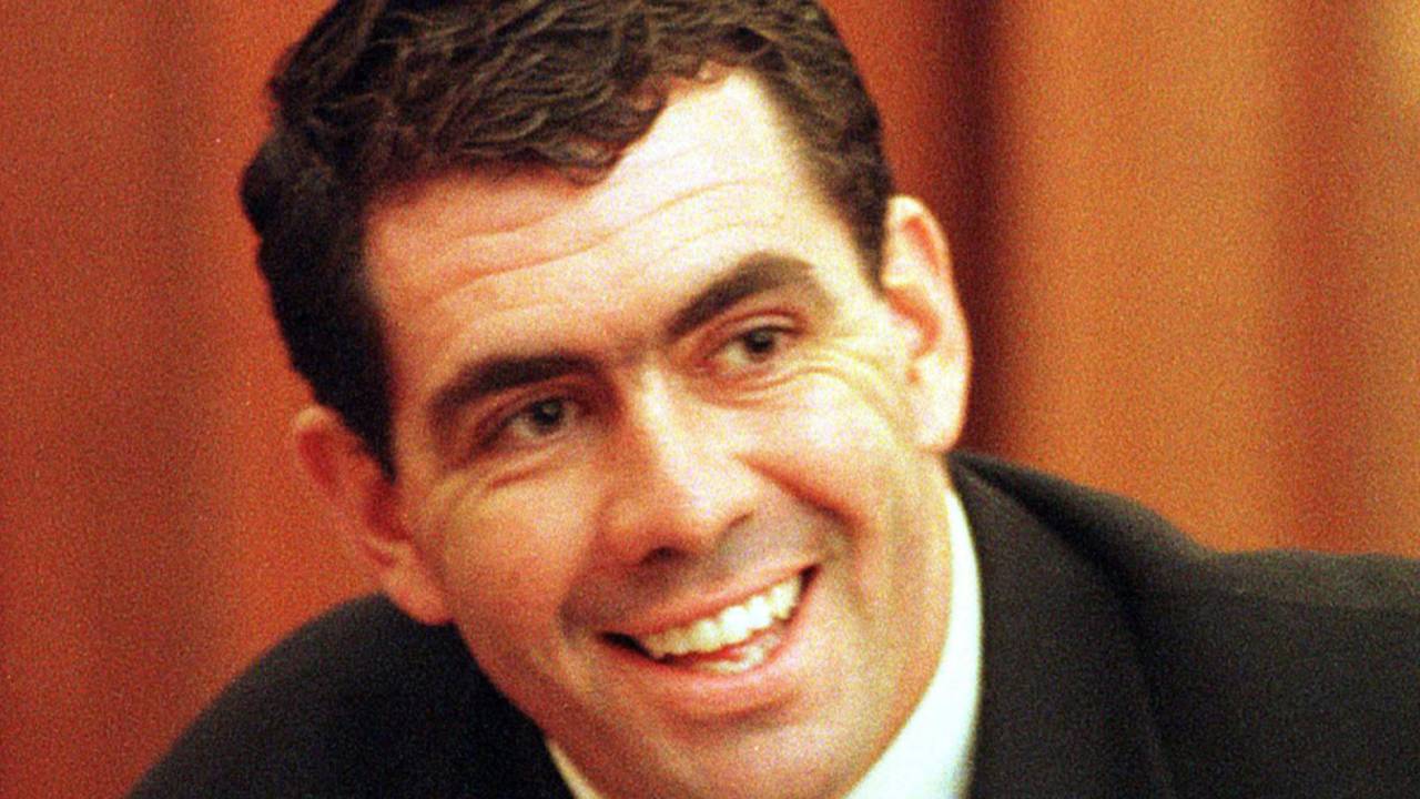 Sacked South African cricket captain Hansie Cronje smiles during his cross-examination at the King Commission of Inquiry into allegations of cricket match-fixing in Cape Town 23 June 2000. Hansie Cronje told the third day of cross-examination here that other players could be involved in match-fixing.