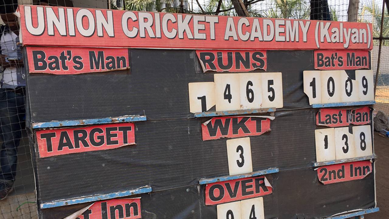 A scoreboard at the ground in Kalyan displays Pranav Dhanawade's record score of 1009*