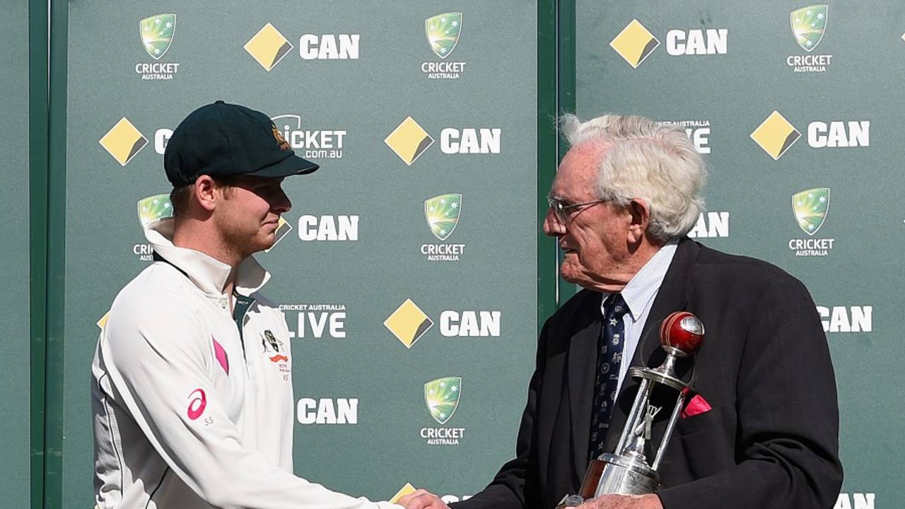 Steven Smith is congratulated by Alan Davidson before receiving the Frank Worrell Trophy
