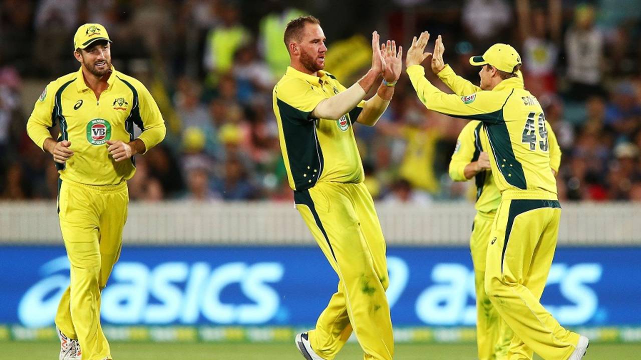 John Hastings celebrates a wicket with his team-mates, Australia v India, 4th ODI, Canberra, January 20, 2016