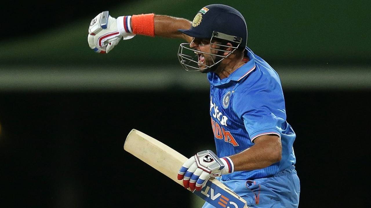 Suresh Raina punches the air after hitting the winning runs, Australia v India, 3rd T20I, Sydney, January 31, 2016