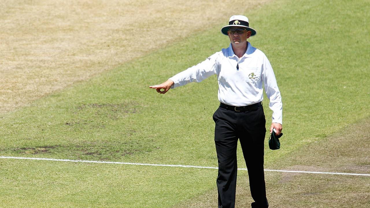 Umpire Sam Nogajski signals a four, Western Australia v Tasmania, day two, Perth, November 1, 2014