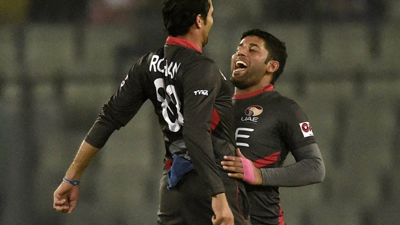 Rohan Mustafa and Mohammad Naveed bump chests to celebrate a wicket&nbsp;&nbsp;&bull;&nbsp;&nbsp;AFP