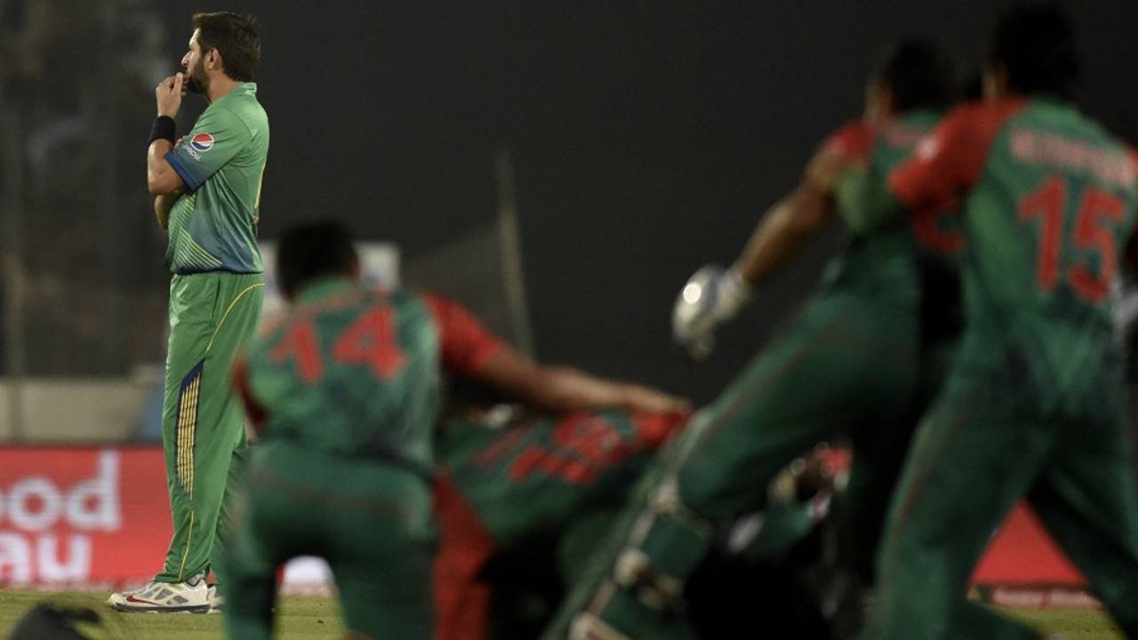 Bangladesh celebrate as Shahid Afridi looks away after Pakistan's loss, Bangladesh v Pakistan, Asia Cup 2016, Mirpur, March 2, 2016