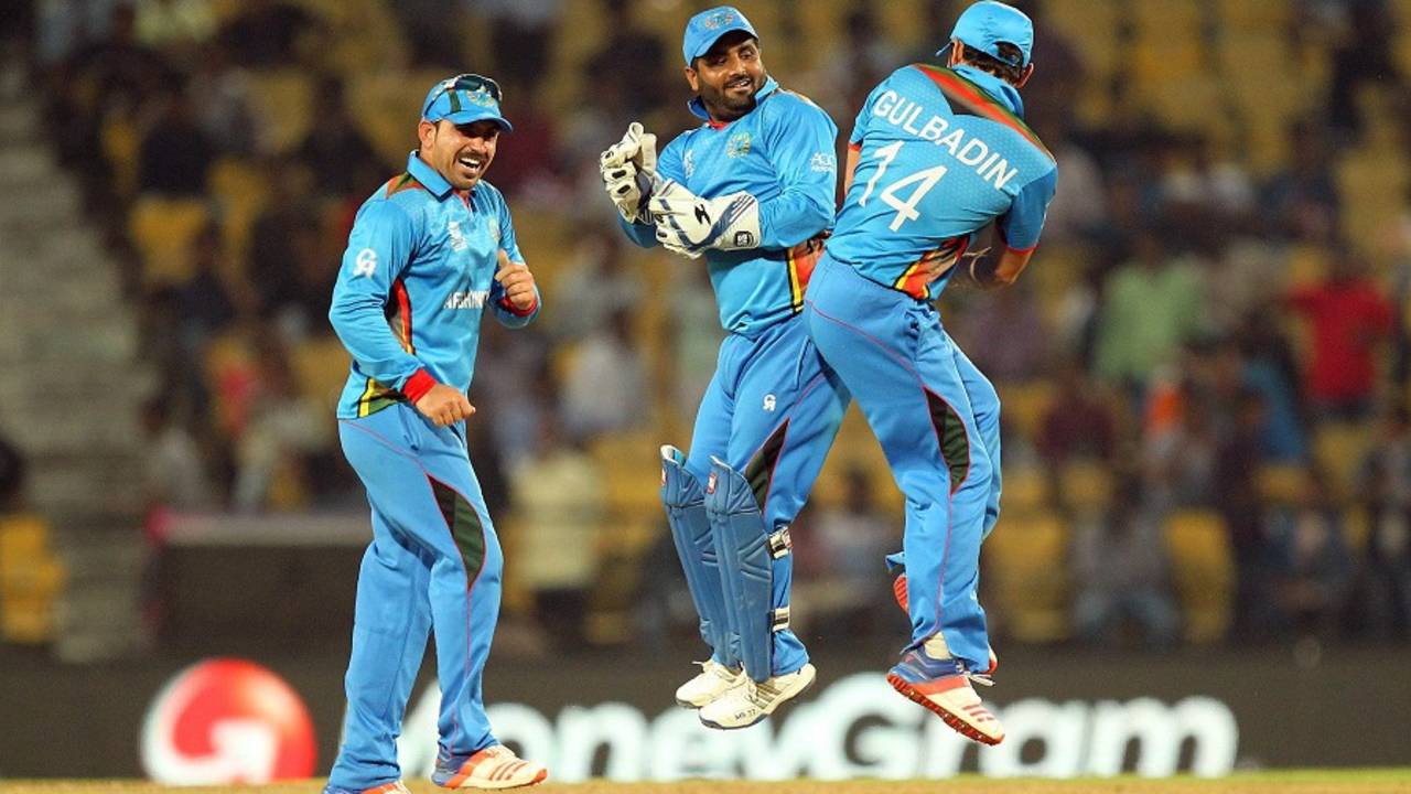 Mohammad Shahzad and Gulbadin Naib celebrate after Afghanistan qualified to the main draw, Afghanistan v Zimbabwe, World T20 qualifiers, Group B, Nagpur, March 12, 2016