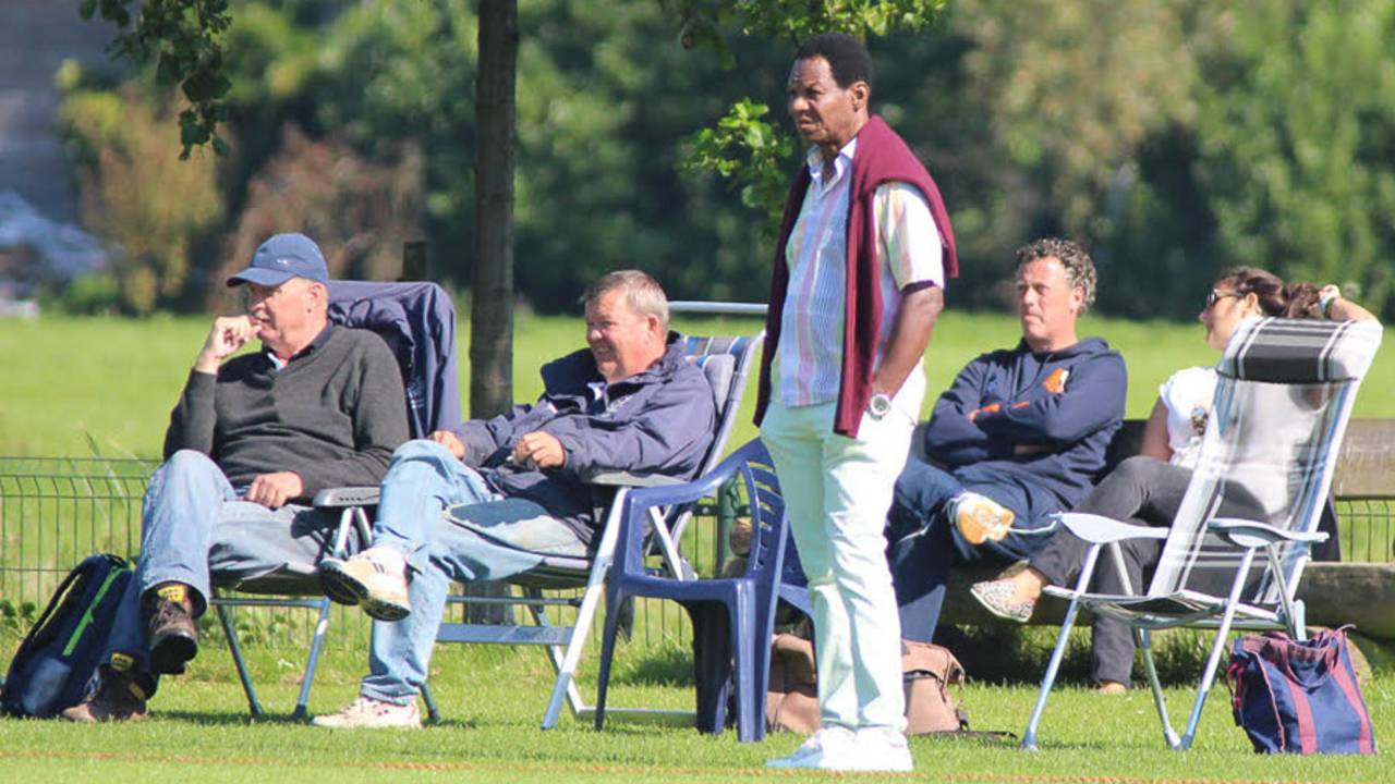 Nolan Clarke (standing) watches Netherlands play, September 14, 2015