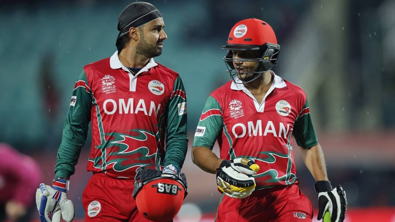 Jatinder Singh and Adnan Ilyas walk off as rain stops play, Bangladesh v Oman, World T20 qualifiers, Group A, Dharamsala, March 13, 2016