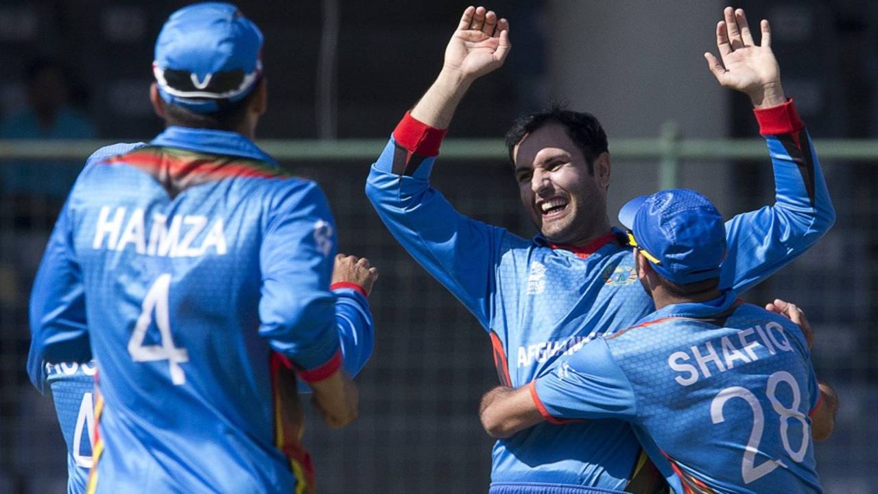Mohammad Nabi celebrates a wicket with his team-mates, Afghanistan v England, World T20 2016, Group 1, Delhi, March 23, 2016