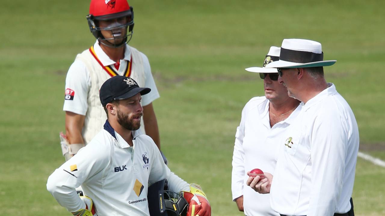 The on-field umpires talk to Matthew Wade before penalising Victoria for ball tampering, South Australia v Victoria, Sheffield Shield Final, Adelaide, third day, March 28, 2016