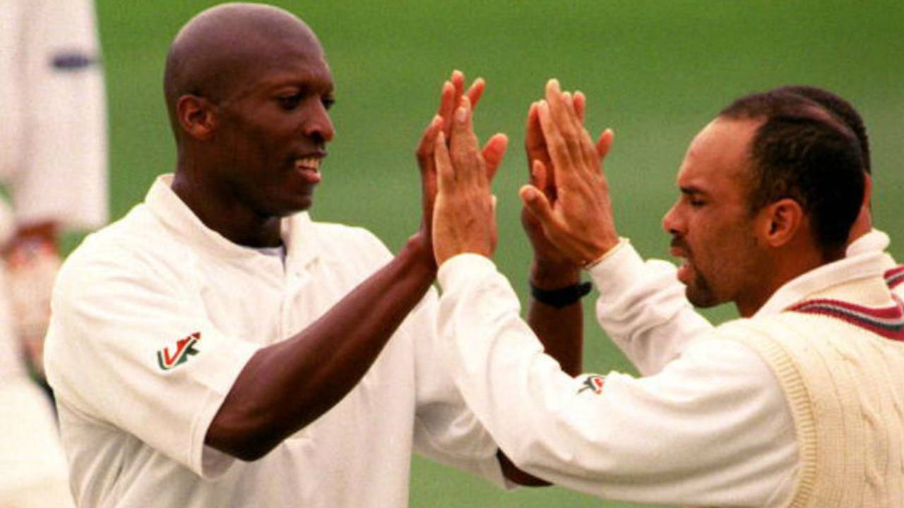 Franklyn Rose celebrates a wicket with Jimmy Adams, December 13, 1999