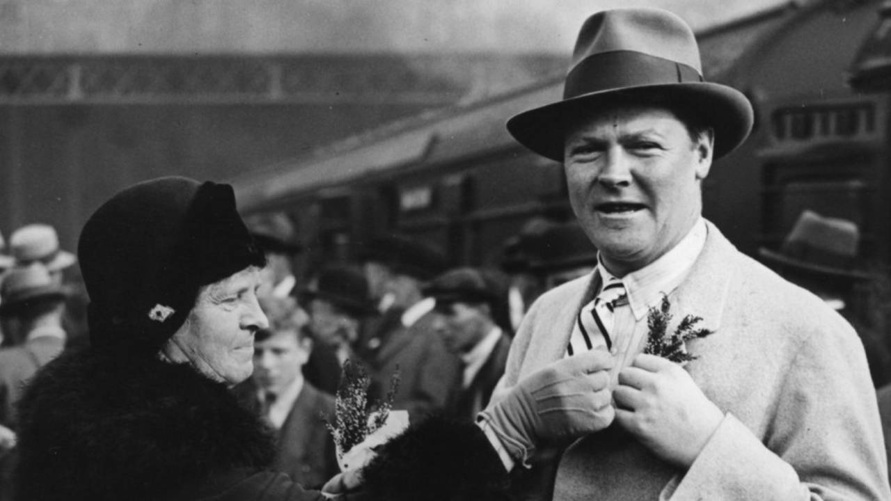 England captain Percy Chapman receives a sprig of "lucky" heather from his mother before leaving for the tour of South Africa, October 16, 1930