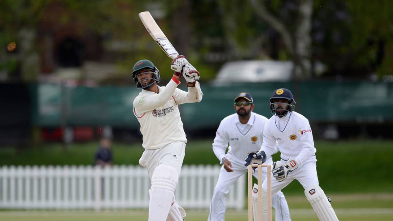 Aadil Ali hits down the ground during his 46