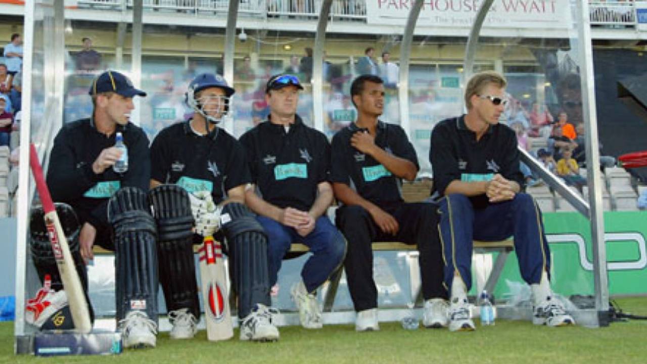 Hampshire players John Crawley, Simon Katich, Shaun Udal, Lawrence Prittipaul and Alan Mullally wait in the dugout during the Twenty20 Cup match between Hampshire and Sussex, Southampton, June 13, 2003 