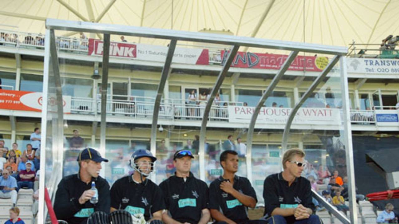 Hampshire players John Crawley, Simon Katich, Shaun Udal, Lawrence Prittipaul and Alan Mullally wait in the dugout during the Twenty20 Cup match between Hampshire and Sussex, Southampton, June 13, 2003 