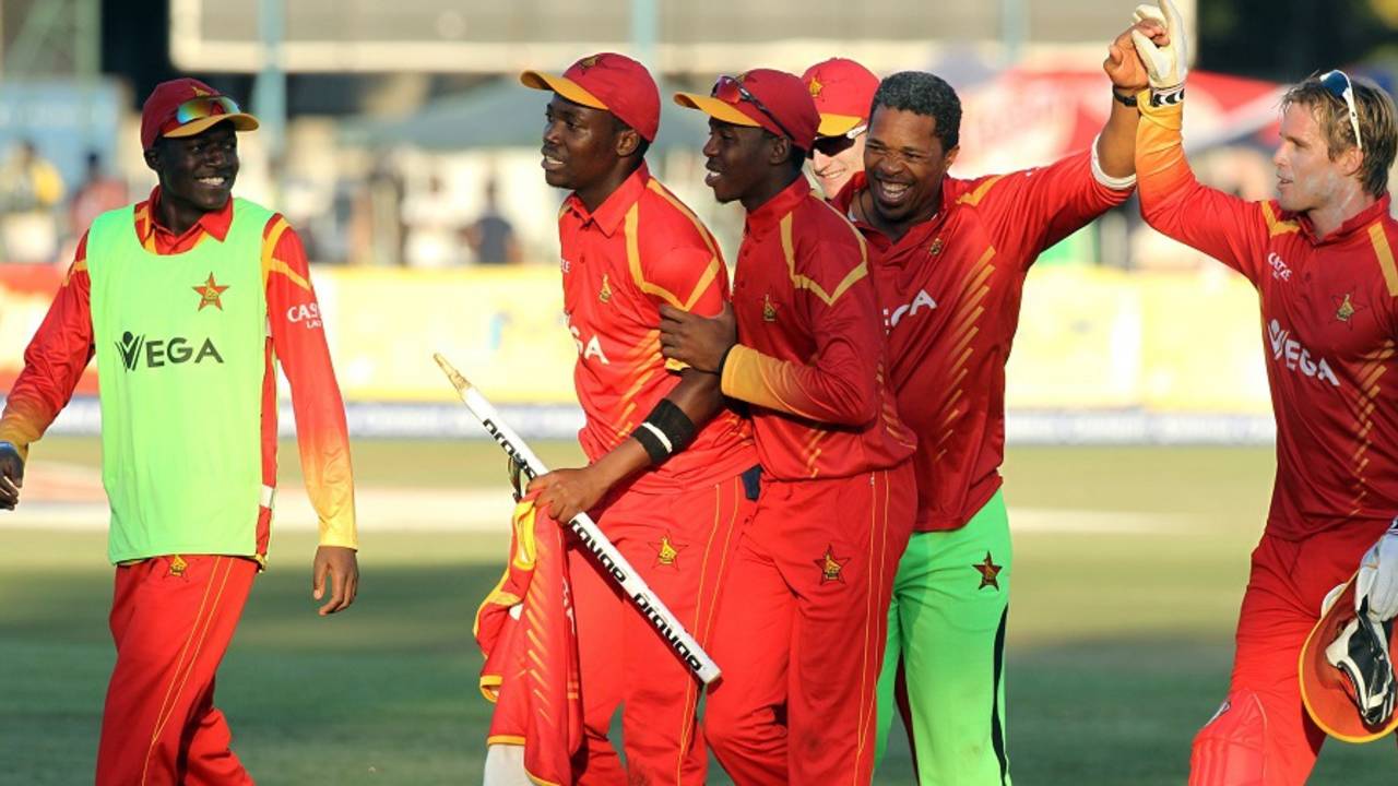 Coach Makhaya Ntini rejoices with the Zimbabwe players, Zimbabwe v India, 1st T20I, Harare, June 18, 2016 