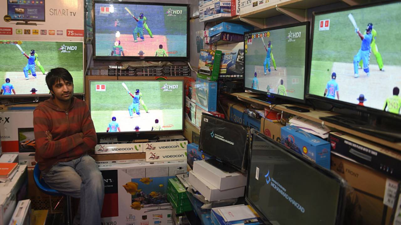 A man watches the India-Pakistan World Cup match in a TV store in Kabul, India v Pakistan, World Cup 2015, Group B, Adelaide, February 15, 2015
