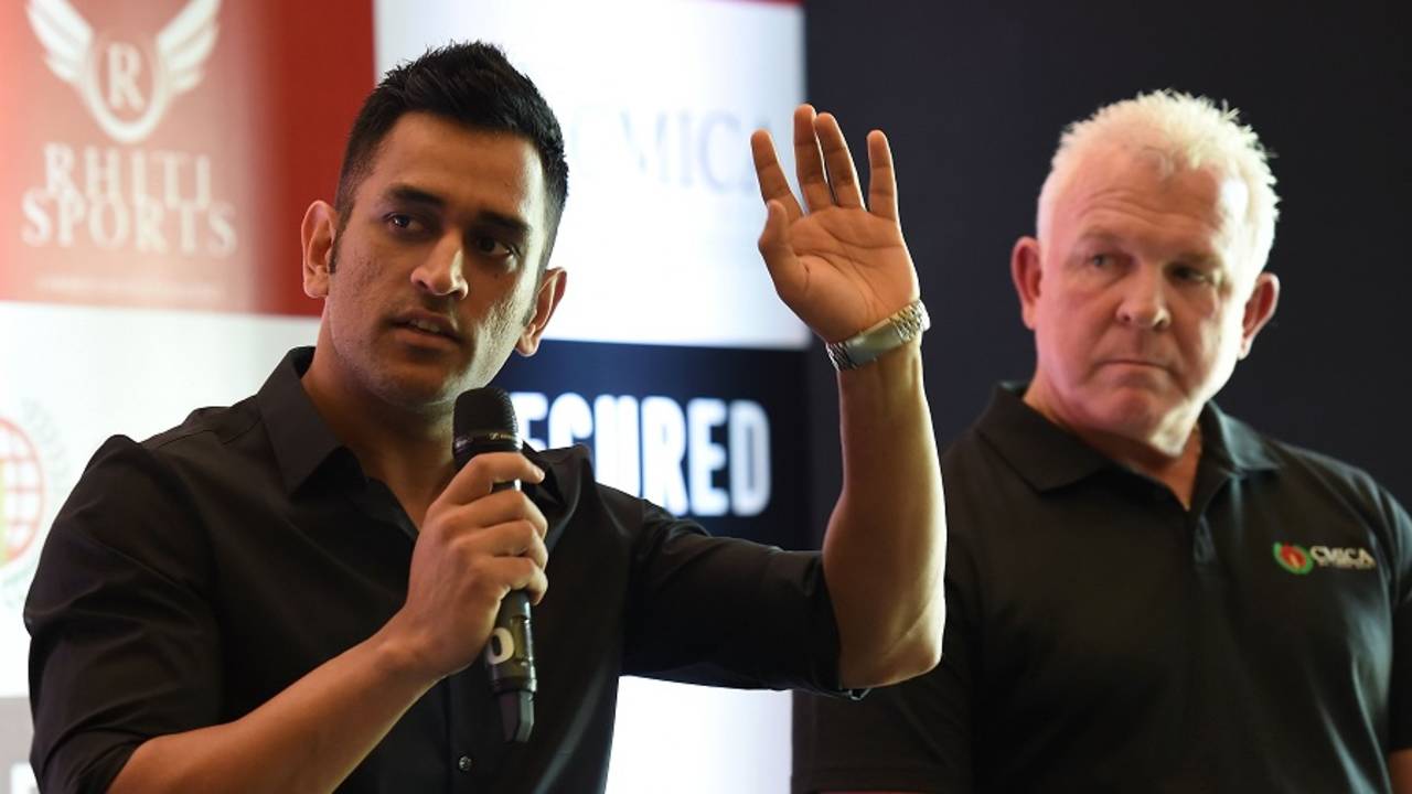 MS Dhoni with Craig McDermott at a promotional event in Delhi