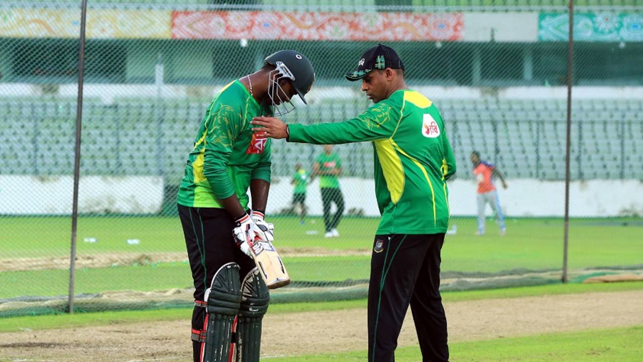 Bangladesh batting consultant Thilan Samaraweera helps Alauddin Babu with his stance