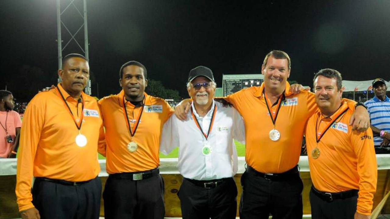 Umpires in the CPL (from left: Wycliffe Mitchum, Leslie Reifer, match referee Dev Govindjee, Johan Cloete and John Ward) line up for a photograph at the end of the match, Guyana Amazon Warriors v Jamaica Tallawahs, final, Caribbean Premier League, Basseterre, August 7, 2016