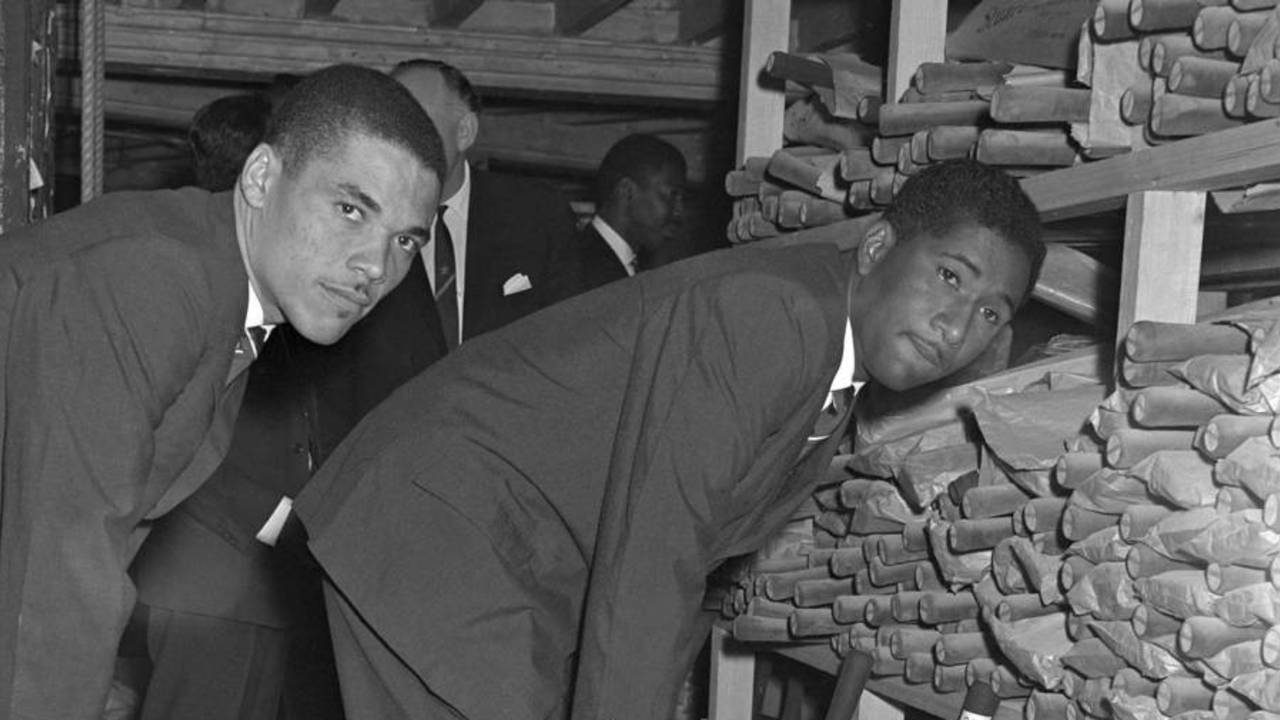 Peter Lashley (left) and Rawle Brancker select cricket bats at Stuart Surridge, at the start of the West Indies tour of England, April 19, 1966