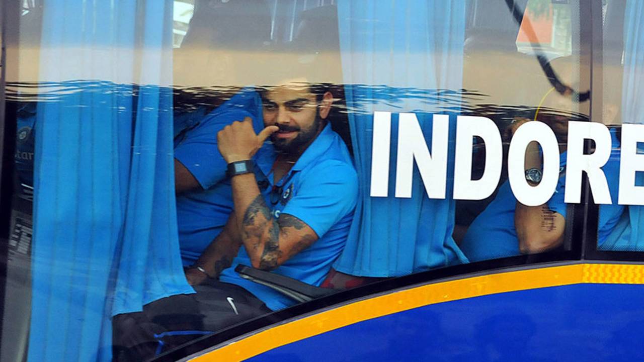 Virat Kohli peers out of the team bus, India v South Africa, 2nd ODI, Indore, October 14, 2015