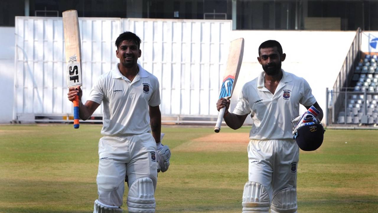 Swapnil Gugale and Ankit Bawne walk off after their record-breaking partnership
