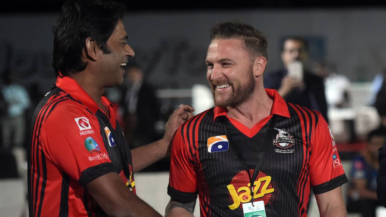 Brendon McCullum shakes hands with Aaqib Javed