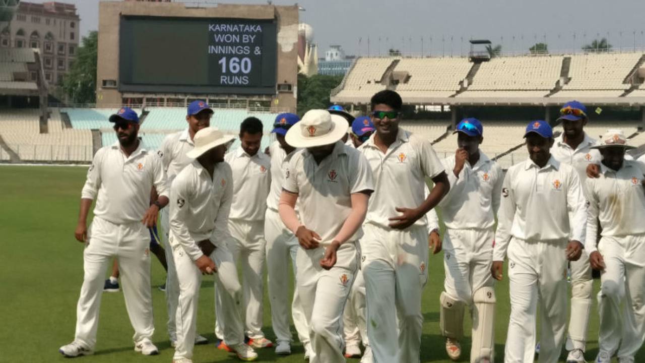 K Gowtham leads Karnataka off the field after their innings and 160-run win over Delhi at Eden Gardens in Kolkata, Karnataka v Delhi, Ranji Trophy 2016-17, Group B, 3rd day, October 22, 2016