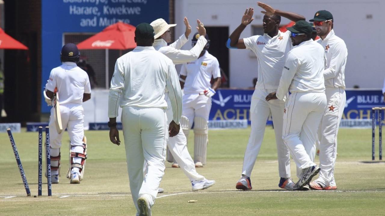 Zimbabwe's players get together to celebrate the dismissal of Kaushal Silva, Zimbabwe v Sri Lanka, 1st Test, Harare, 4th day, November 1, 2016