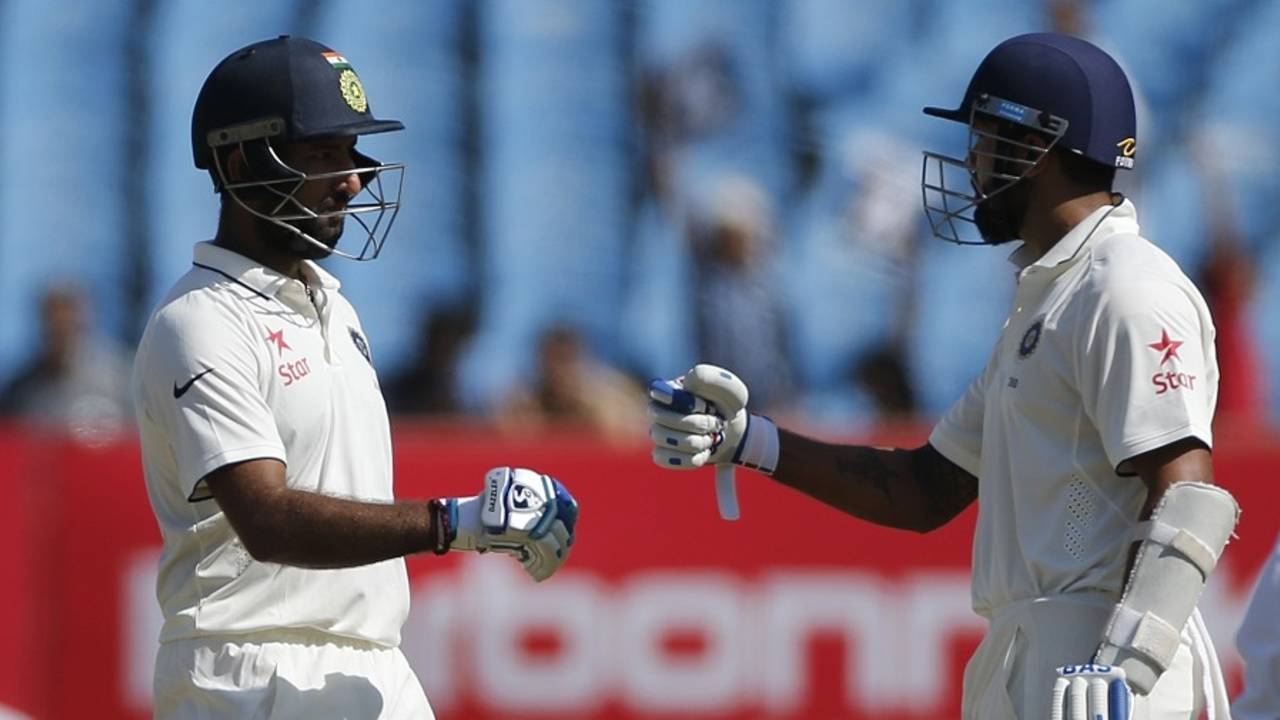 Cheteshwar Pujara congratulates M Vijay on his 15th Test fifty, India v England, 1st Test, Rajkot, 3rd day, November 11, 2016