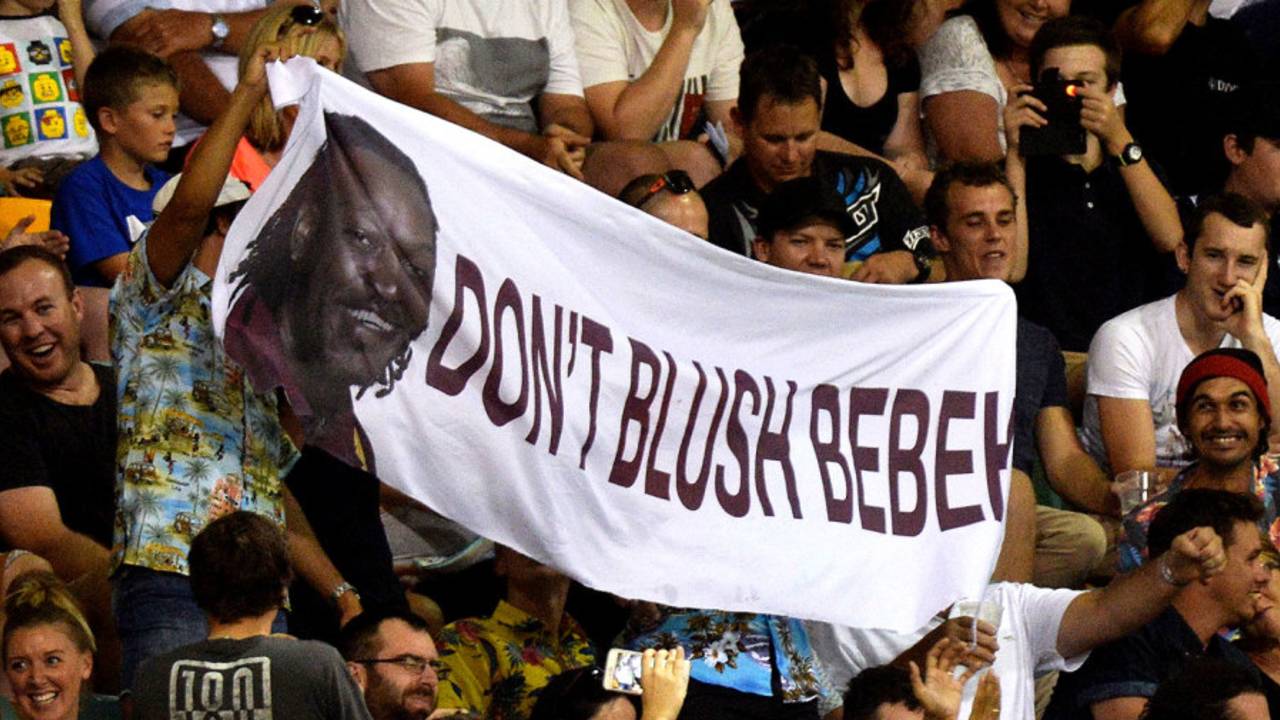 Spectators hold up a banner referring to Chris Gayle's comments to a female sports presenter, Brisbane Heat v Adelaide Strikers, BBL 2015-16, Brisbane, January 8, 2016