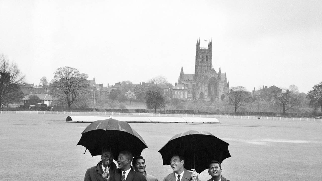From left: Berkeley Gaskin (manager), Lester King, Deryck Murray, Willie Rodriguez and Joe Solomon of West Indies shelter from the rain that washed out the first day of the match, Worcestershire v West Indies, tour match, day one, May 1, 1963