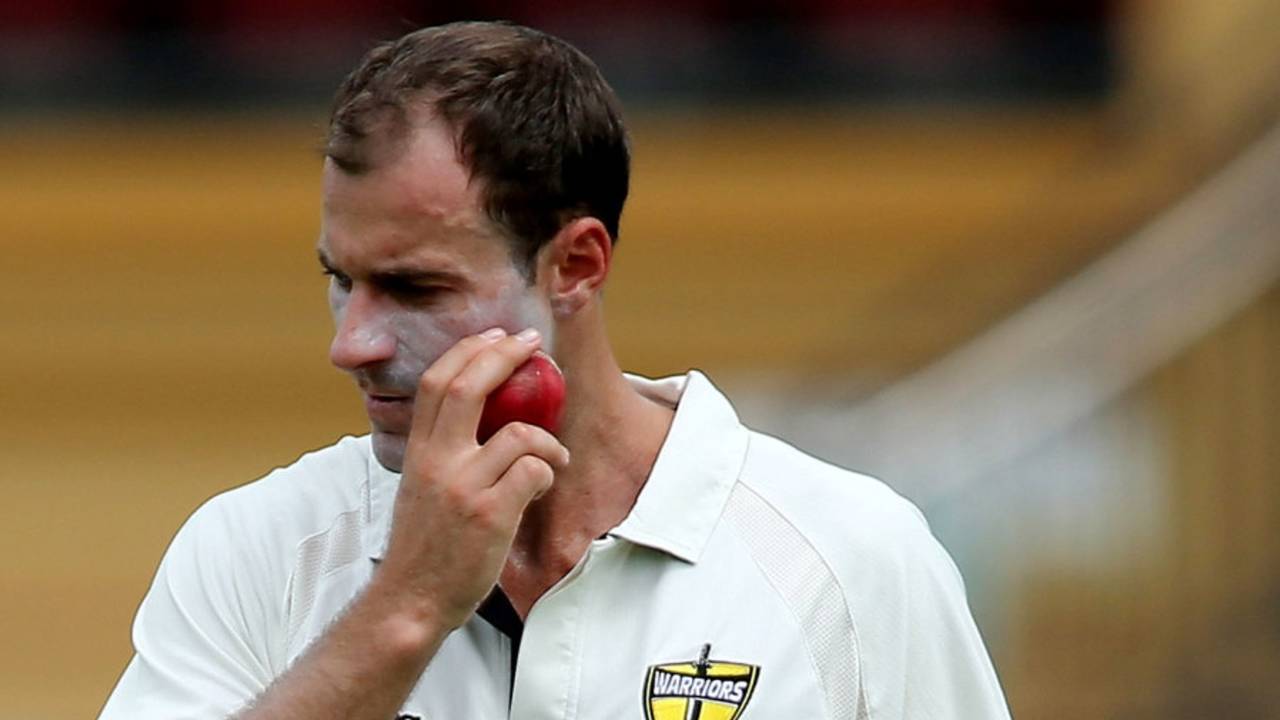 Burt Cockley appears to be rubbing the ball on his face, Sheffield Shield, South Australia v Western Australia, Adelaide, 1st day, March 7, 2013