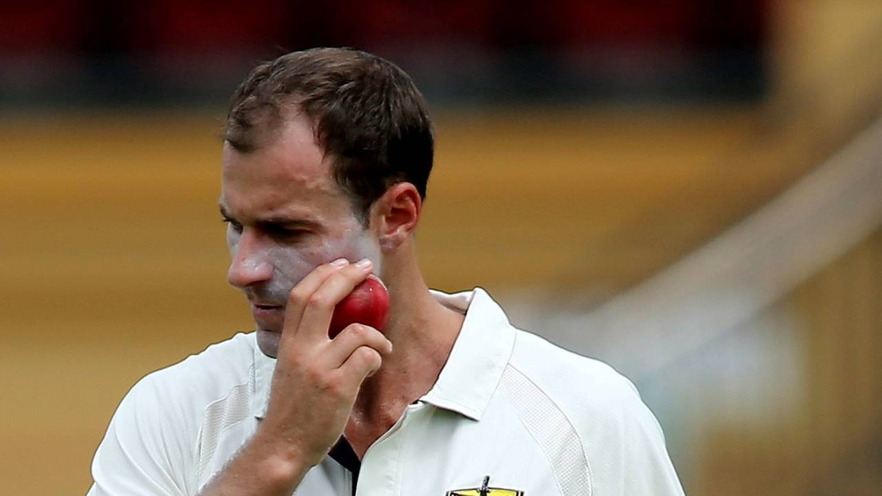 Burt Cockley appears to be rubbing the ball on his face, Sheffield Shield, South Australia v Western Australia, Adelaide, 1st day, March 7, 2013