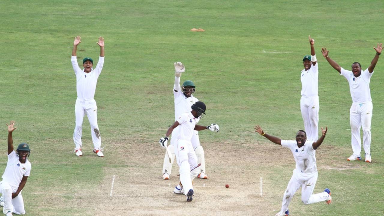 Guyana players go up in unison against Isaiah Rajah, Guyana v Trinidad & Tobago, Regional 4 Day Tournament, Providence, 3rd day, December 18, 2016