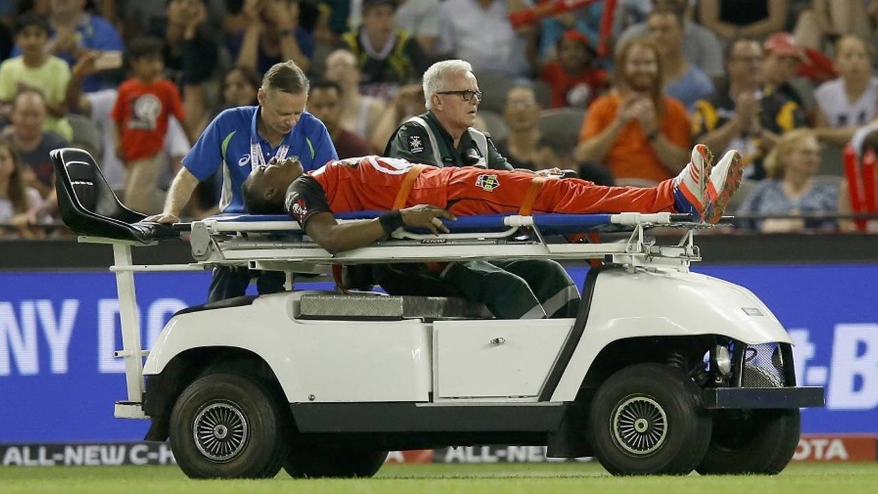 Dwayne Bravo was stretchered off the field after jarring his foot near the boundary, Renegades v Scorchers, Big Bash League, Melbourne, December 29, 2016