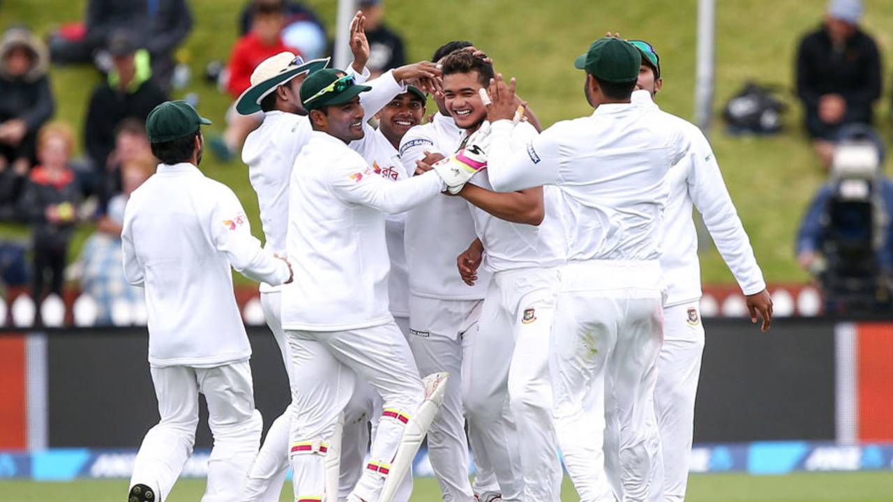 Taskin Ahmed is surrounded by team-mates after claiming Kane Williamson for his maiden Test wicket, New Zealand v Bangladesh, 1st Test, Wellington, 3rd day, January 14, 2017