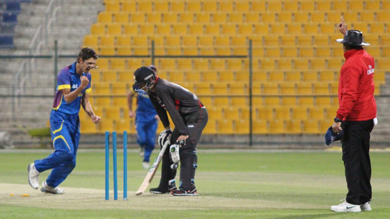 Colin Peake pumps his fist after deflecting the ball onto the stumps in his follow-through to run out Rohan Mustafa, UAE v Namibia, Desert T20, Group A, Abu Dhabi, January 15, 2017