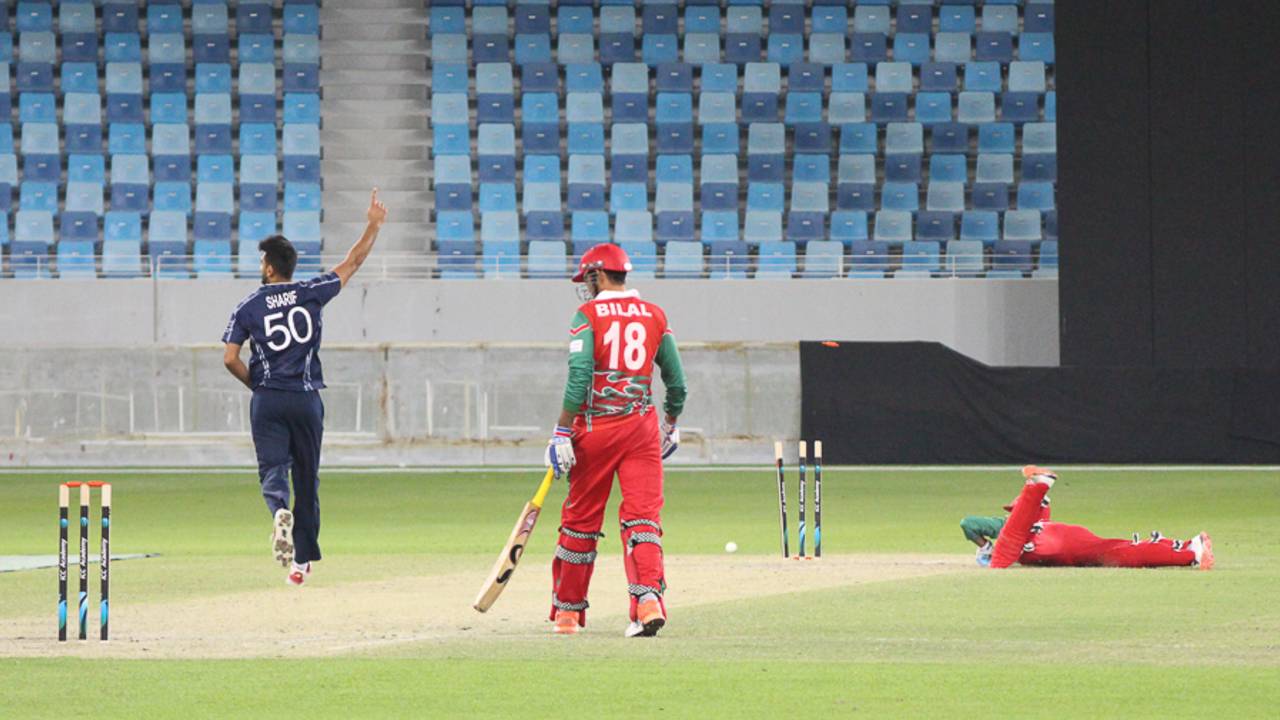 Safyaan Sharif celebrates after Sultan Ahmed is run out on the last ball of the Oman innings