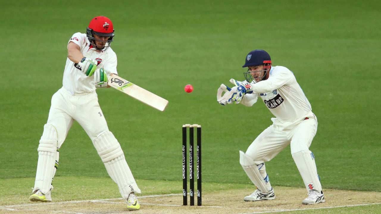 Alex Carey cuts the ball watched by wicketkeeper Peter Nevill&nbsp;&nbsp;&bull;&nbsp;&nbsp;Getty Images