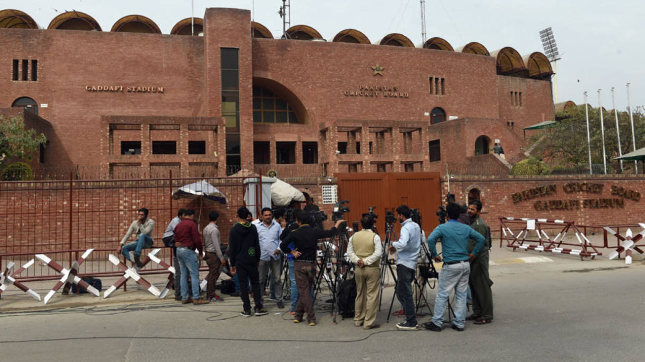 Media personnel wait outside the Gaddafi Stadium&nbsp;&nbsp;&bull;&nbsp;&nbsp;AFP