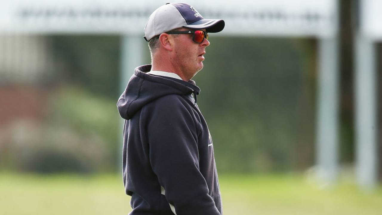 Victoria's bowling coach Mick Lewis helps the players warm up, Adelaide, March 29, 2016