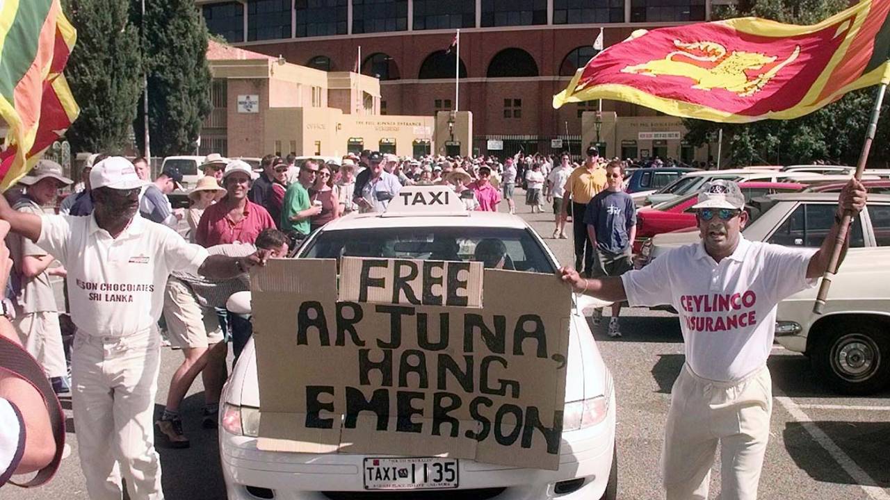 Sri Lankan fans hold up a banner in support of Arjuna Ranatunga as he leaves a disciplinary hearing at Adelaide Oval for breaching the code of conduct, January 26, 1999
