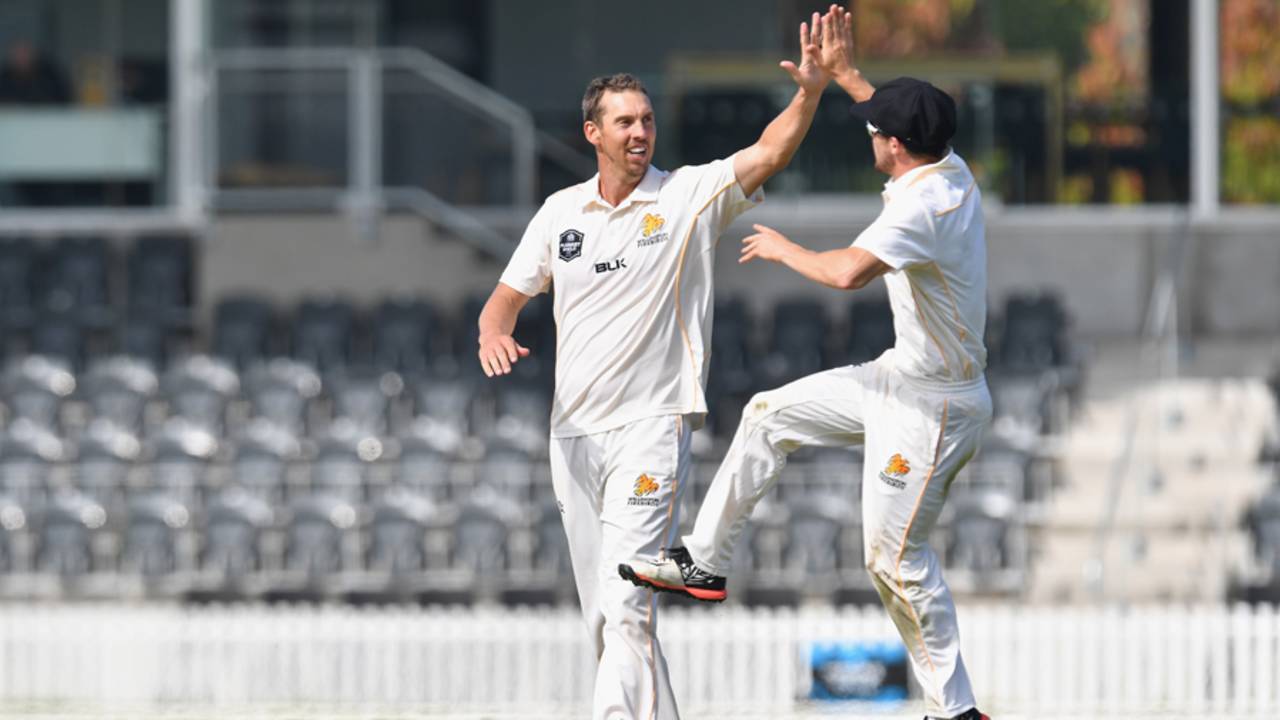 Brent Arnel receives a high-five from his team-mate, Canterbury v Wellington, Plunket Shield, 2nd day, Christchurch, March 30, 2017