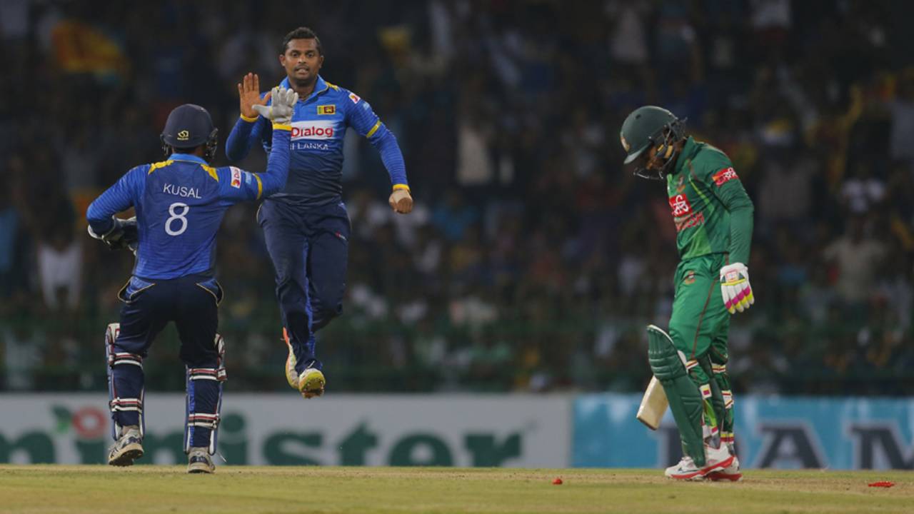 Asela Gunaratne receives a high-five from Kusal Perera on dismissing Mushfiqur Rahim, Sri Lanka v Bangladesh, 1st T20I, Colombo, April 4, 2017